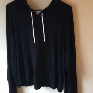 Black long sleeve sweater with a hood